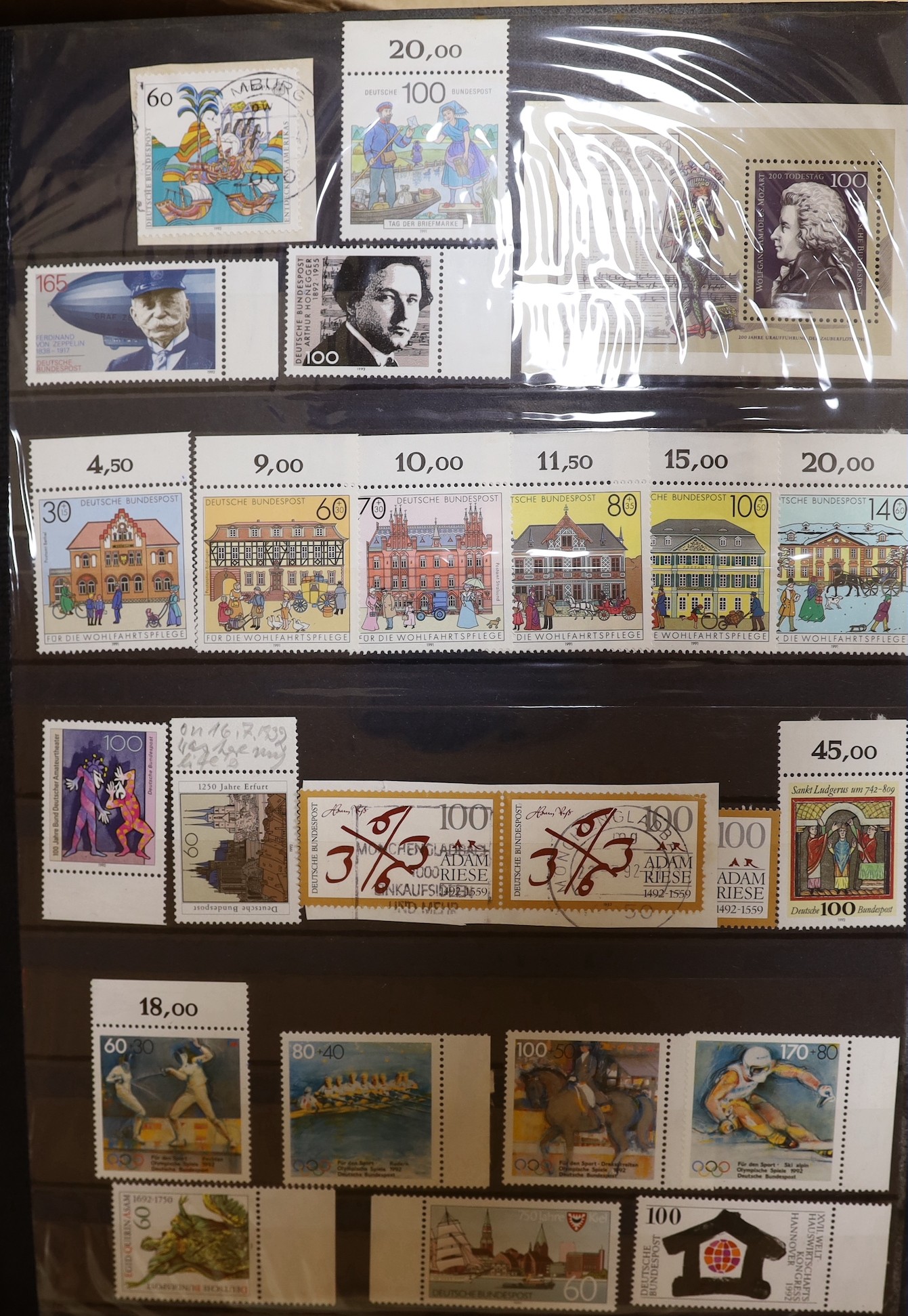Four stock books of British stamps, QEII mint unused definitives and stamp books, some pre-decimal and two stock books of DDR used and mint unused stamps